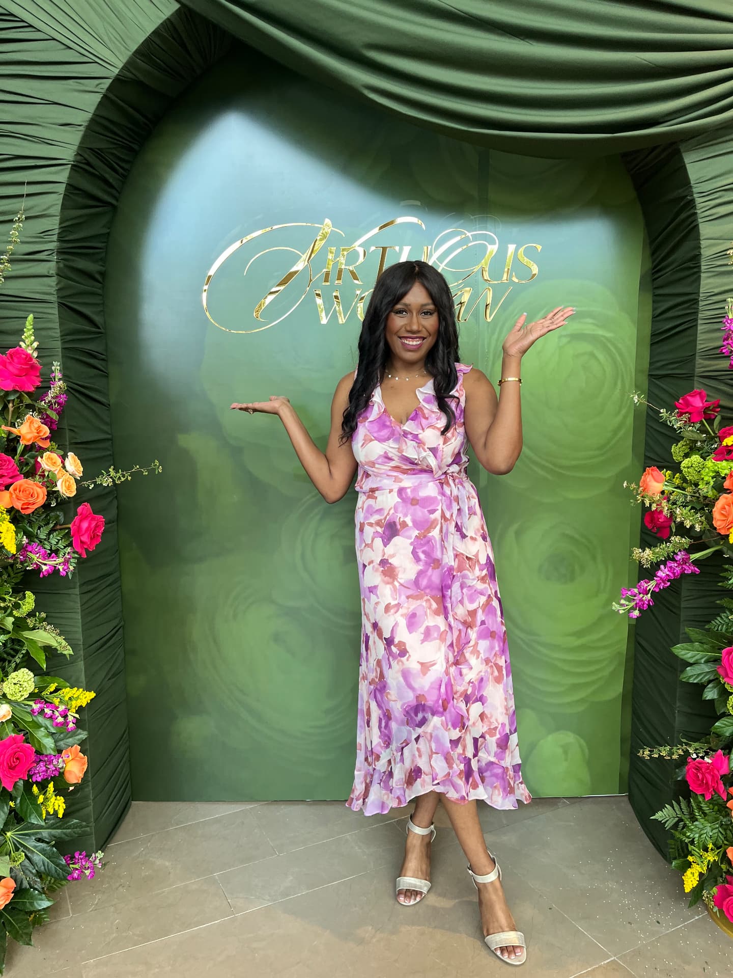 Jasmine Trevino, founder of Reclaimed Joy Coaching Services, smiling warmly in a floral dress