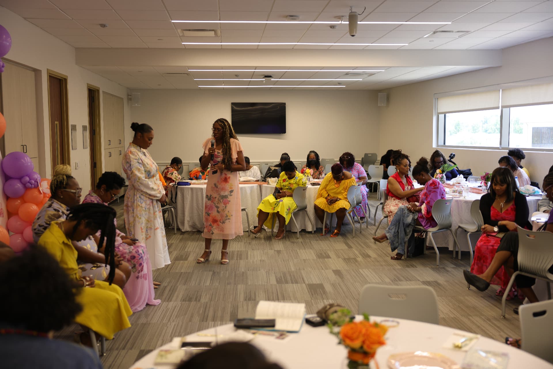 Jasmine Trevino speaking to a room of women at a faith centered event